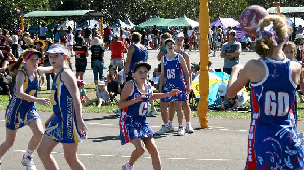 Lauren Whittaker (GD) throws a pass to Warwick 2 teammate Makenzi Burton (C) in the 12 years comp. Lauren Whittaker (GD) throws a pass to Warwick 2 teammate Makenzi Burton (C) in the 12 years comp.